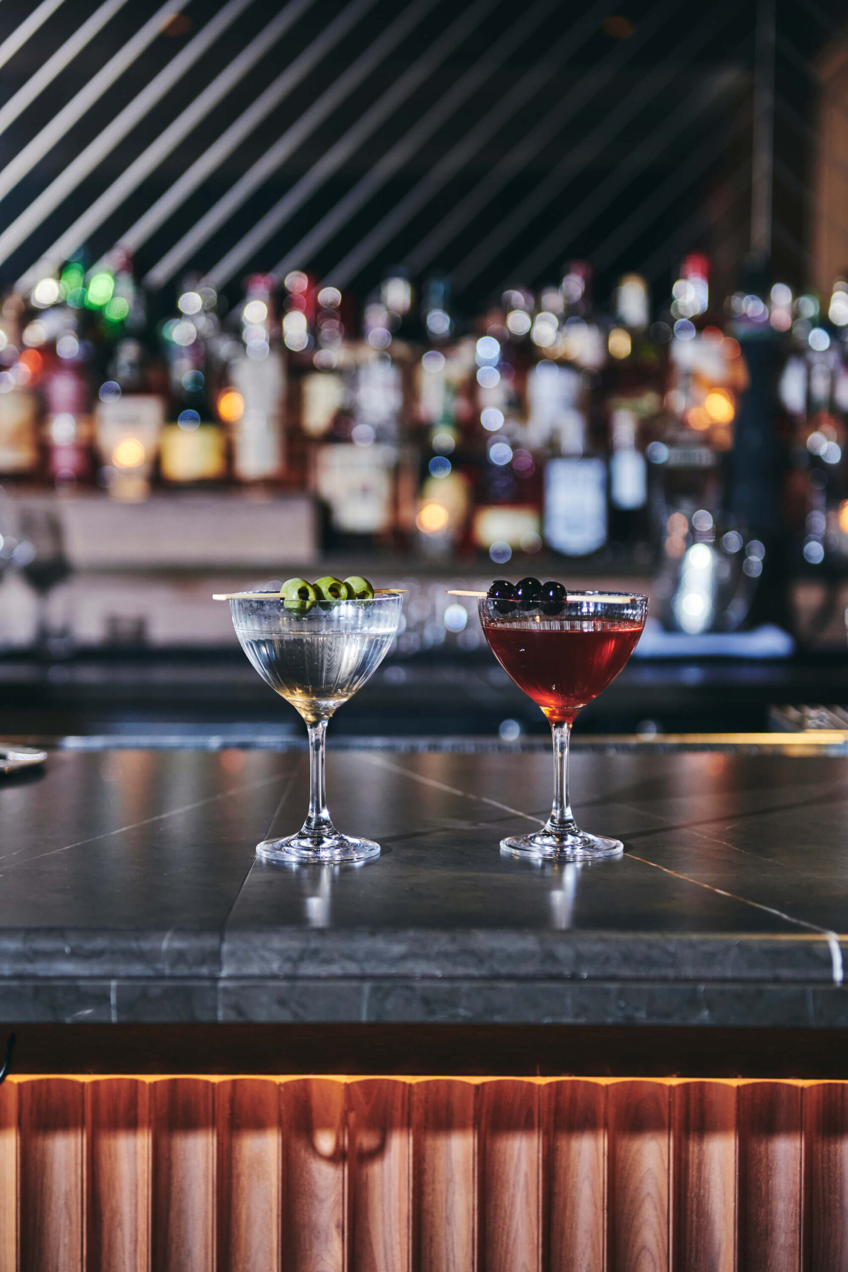 Two cocktails on the bar in Bar Pendry at Pendry Chicago.