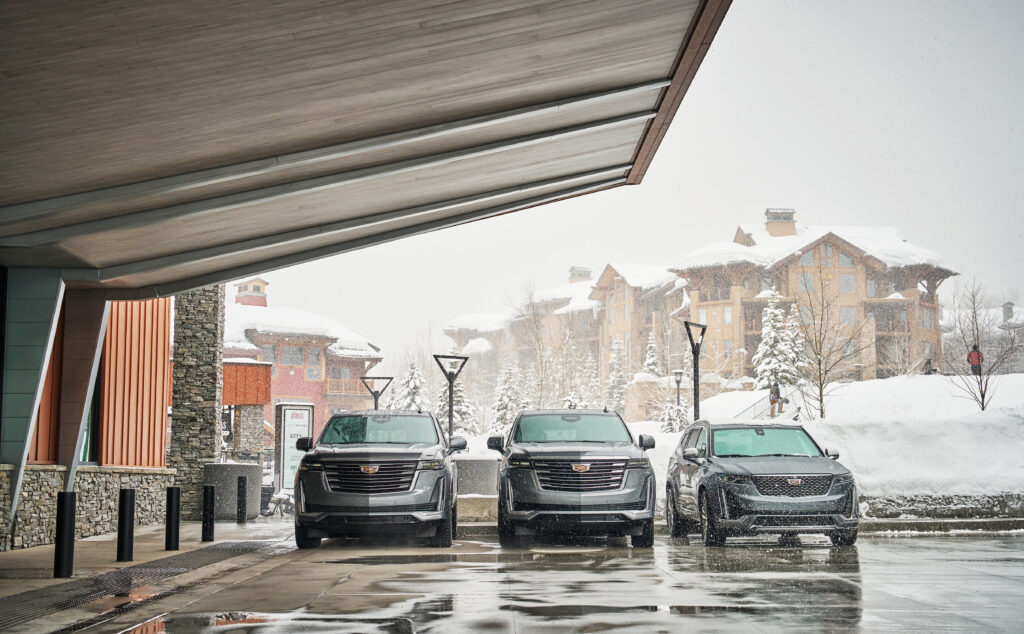 Three silver Cadillac SUV's outside of Pendry park City