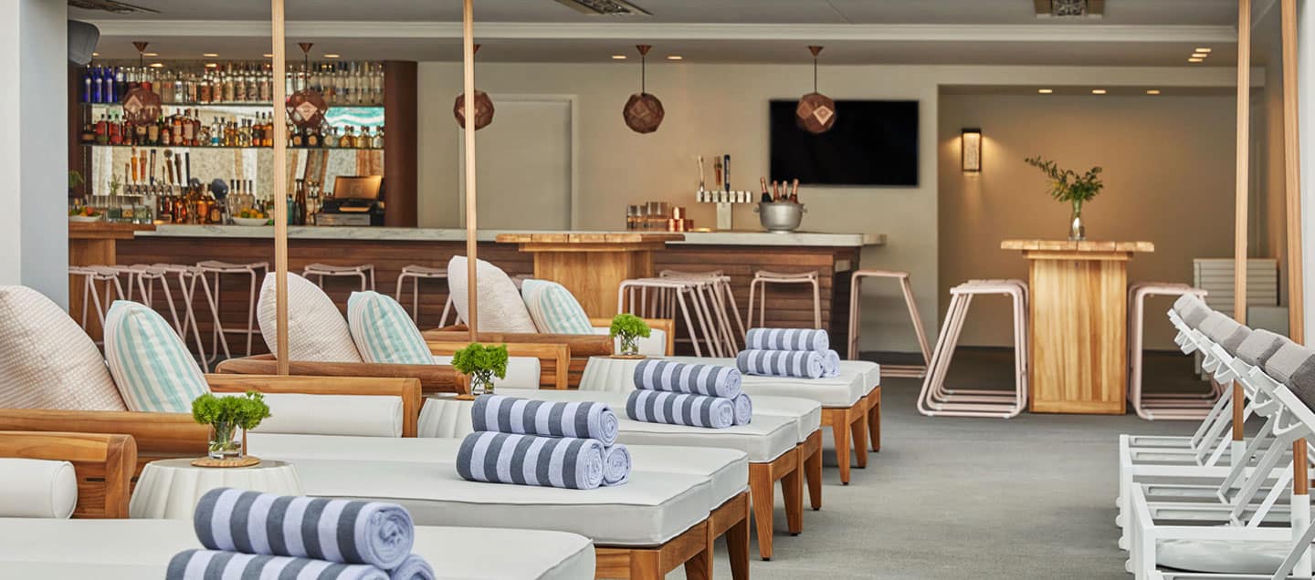 Lounge chairs with towels by the pool