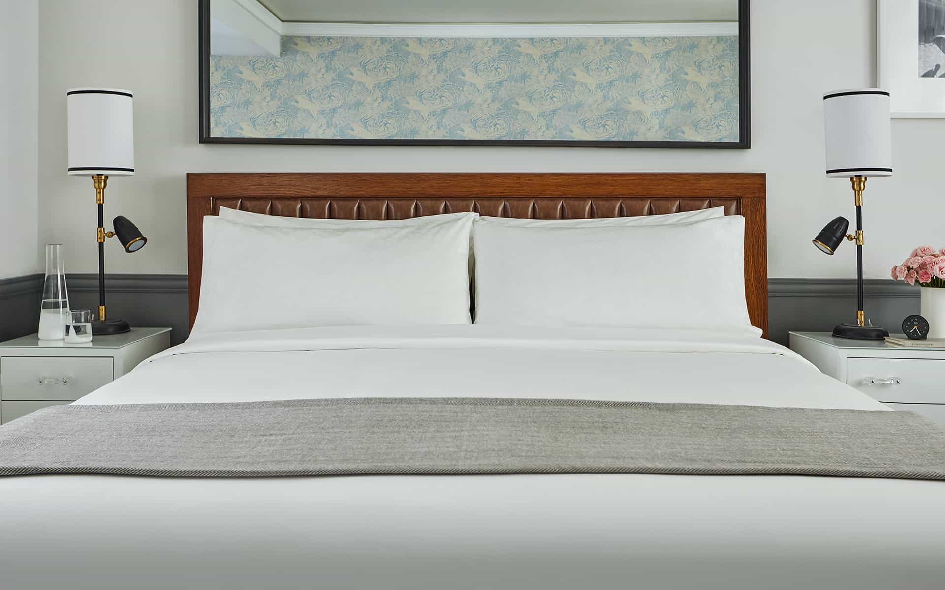 Closeup of bed in luxury hotel room at Pendry San Diego