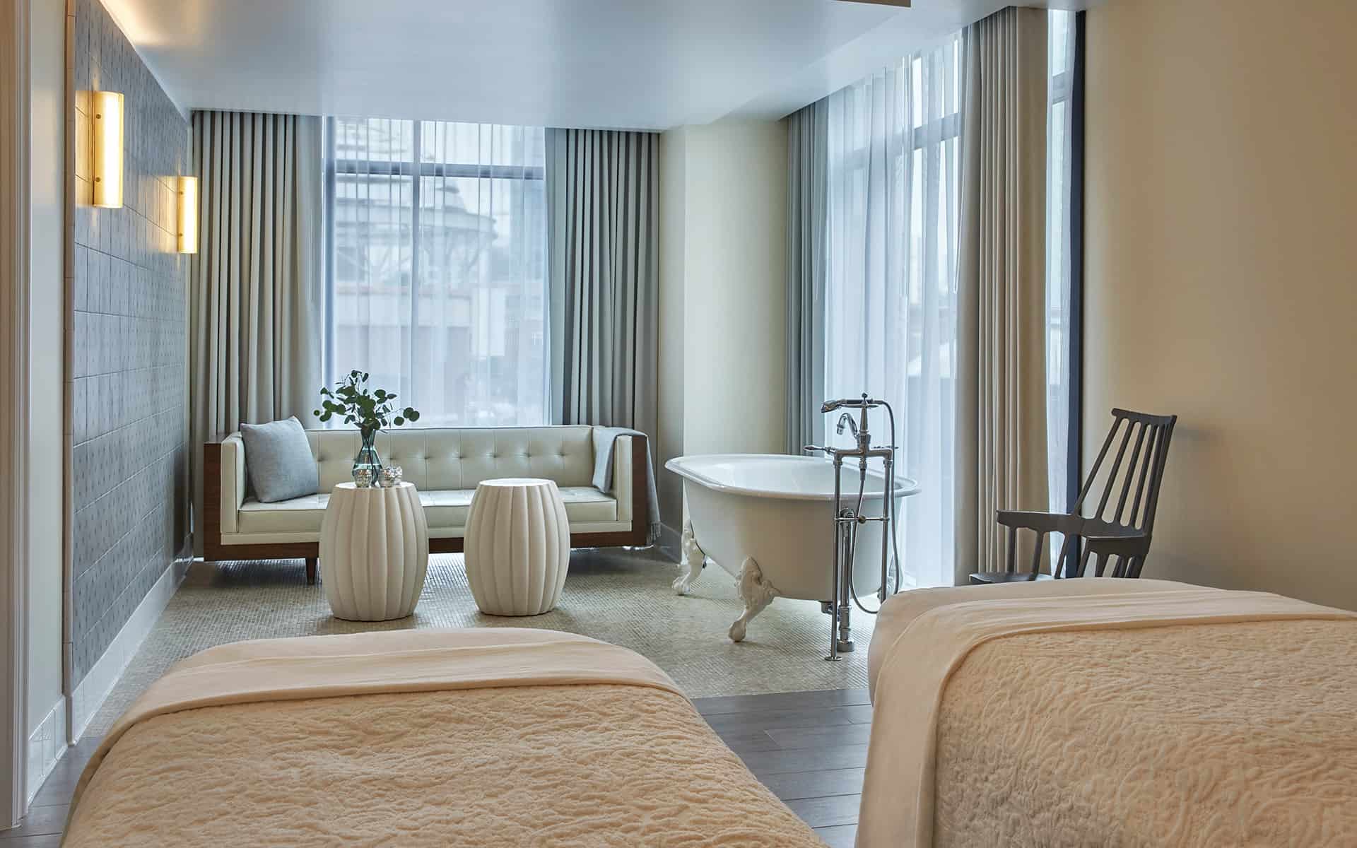 Spa Pendry couples treatment room with massage tables and bathtub a luxury full service spa in the Gaslamp Quarter of Downtown San Diego