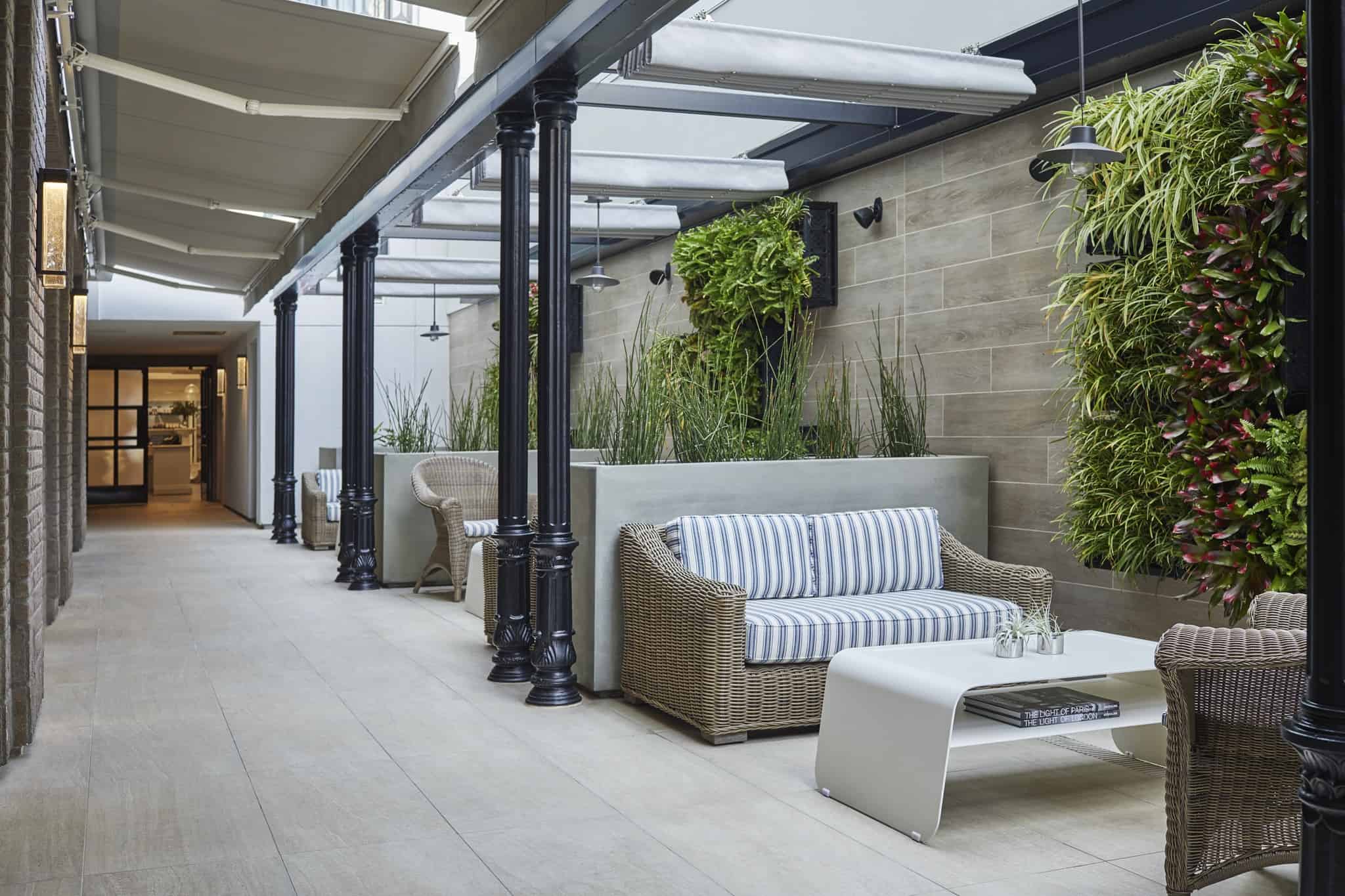 Spa relaxation area with couches and tables at San Diego luxury spa