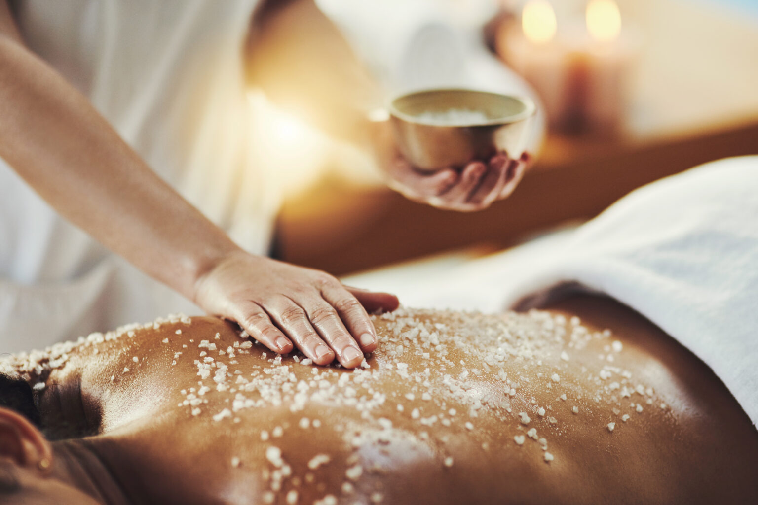Closeup shot of a woman getting an exfoliating massage at a spa in luxury san diego hotel