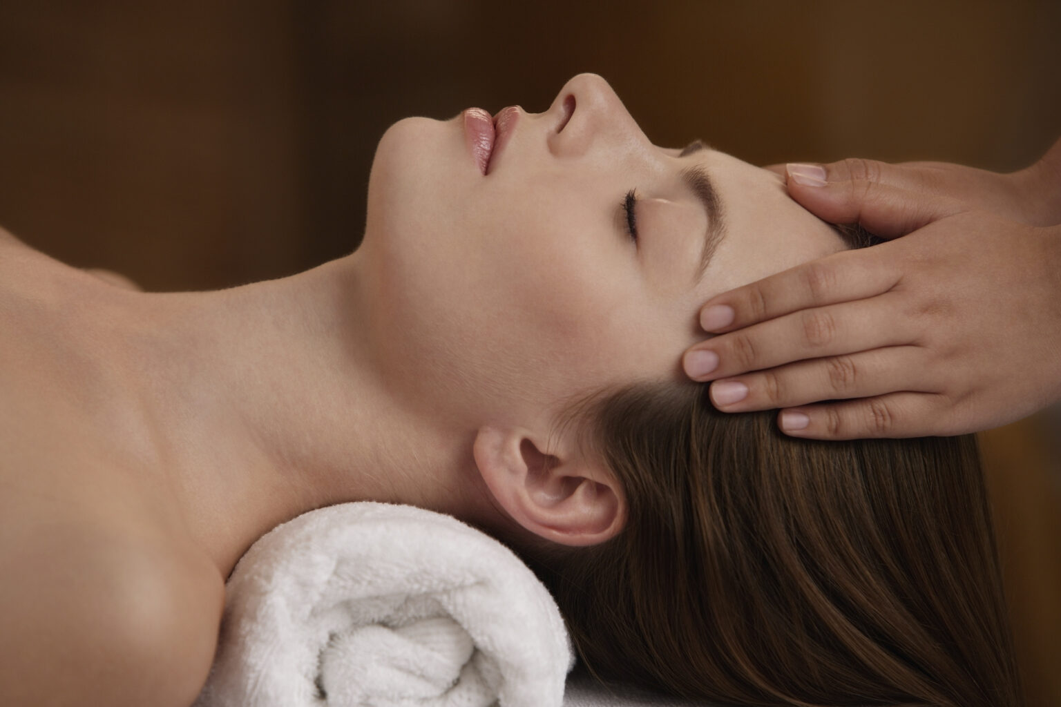 Young woman receiving reiki massage at luxury San Diego spa