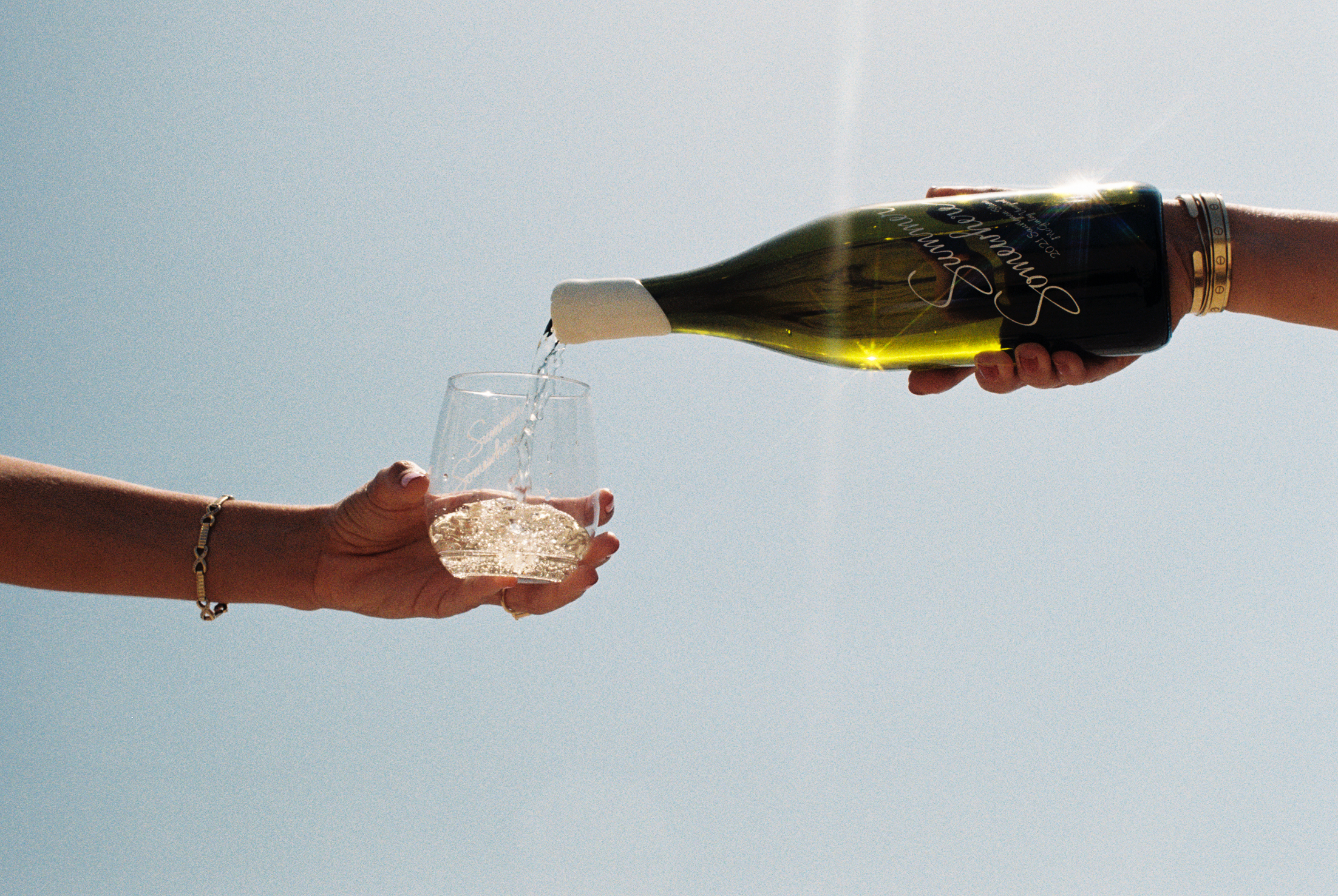 a glass of wine being poured