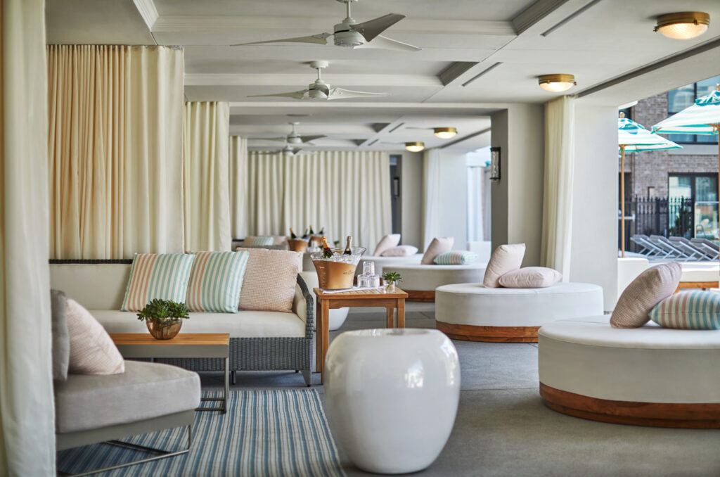 Shaded seating by the pool at Pendry San Diego
