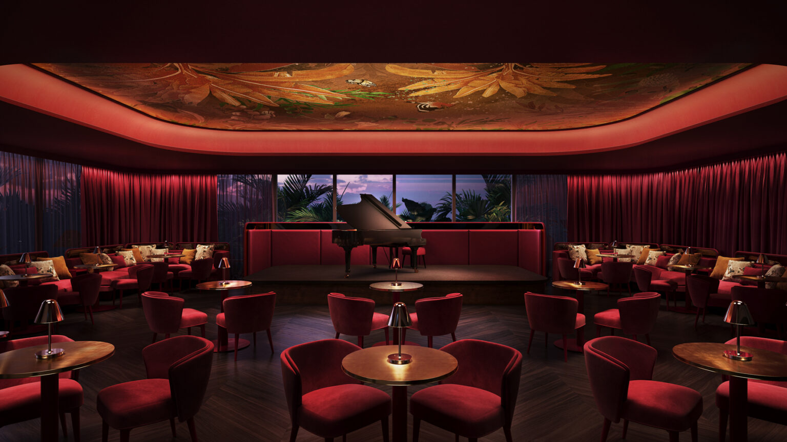 Red velvet chairs surrounding tables in The Cabaret at the Elwood Club.