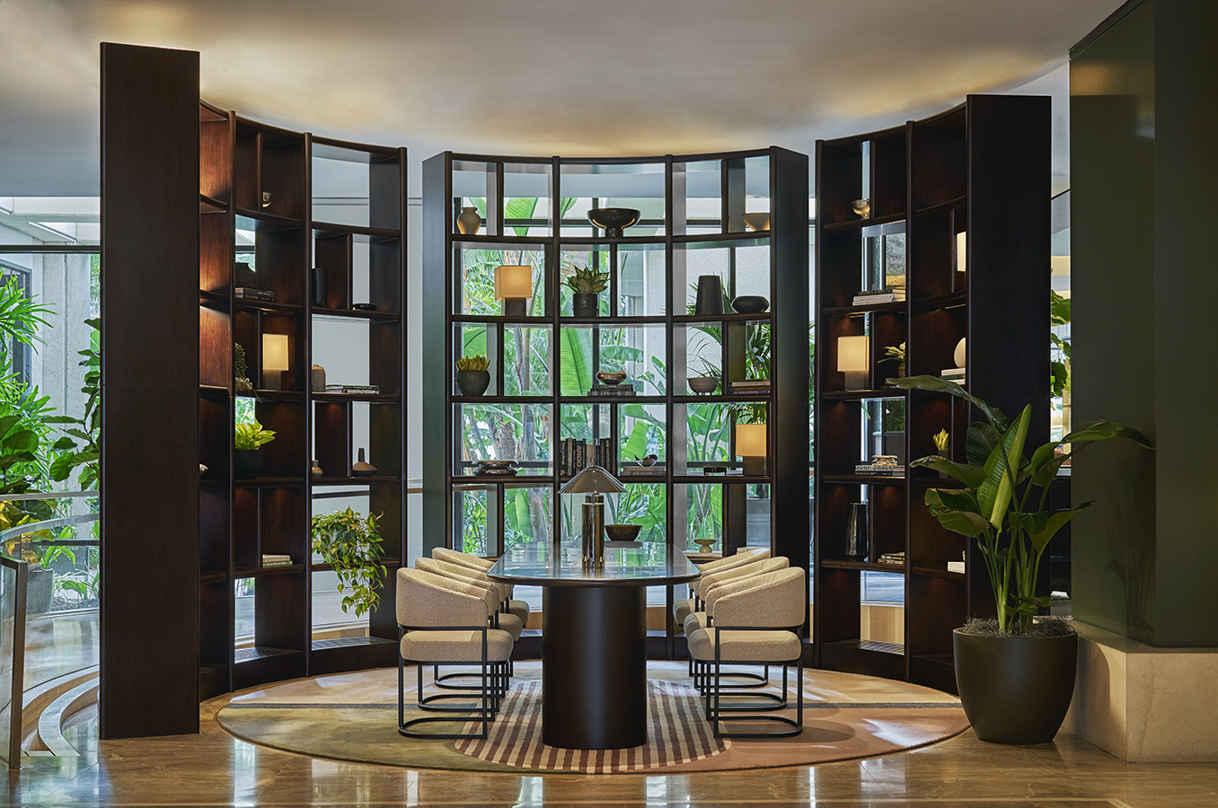 Lobby at Pendry Newport Beach hotel, with table and decorated bookshelf