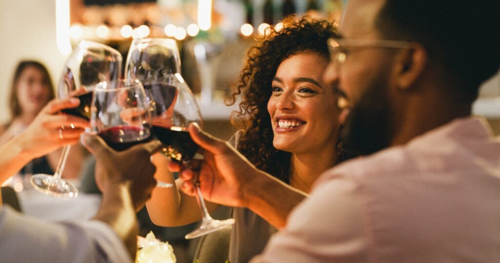 Cheers of wine with group