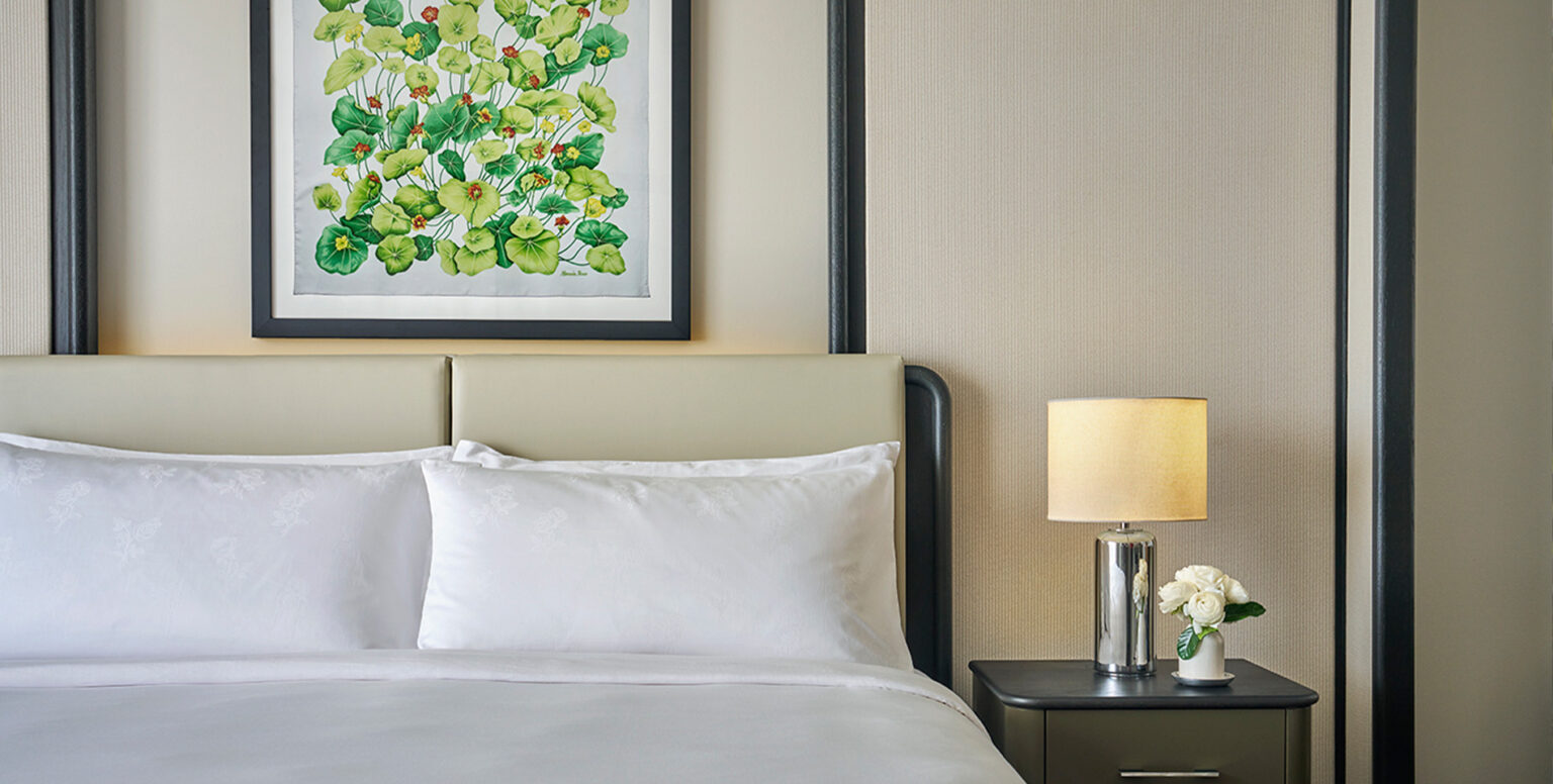 A bed in a guestroom at Pendry Newport Beach