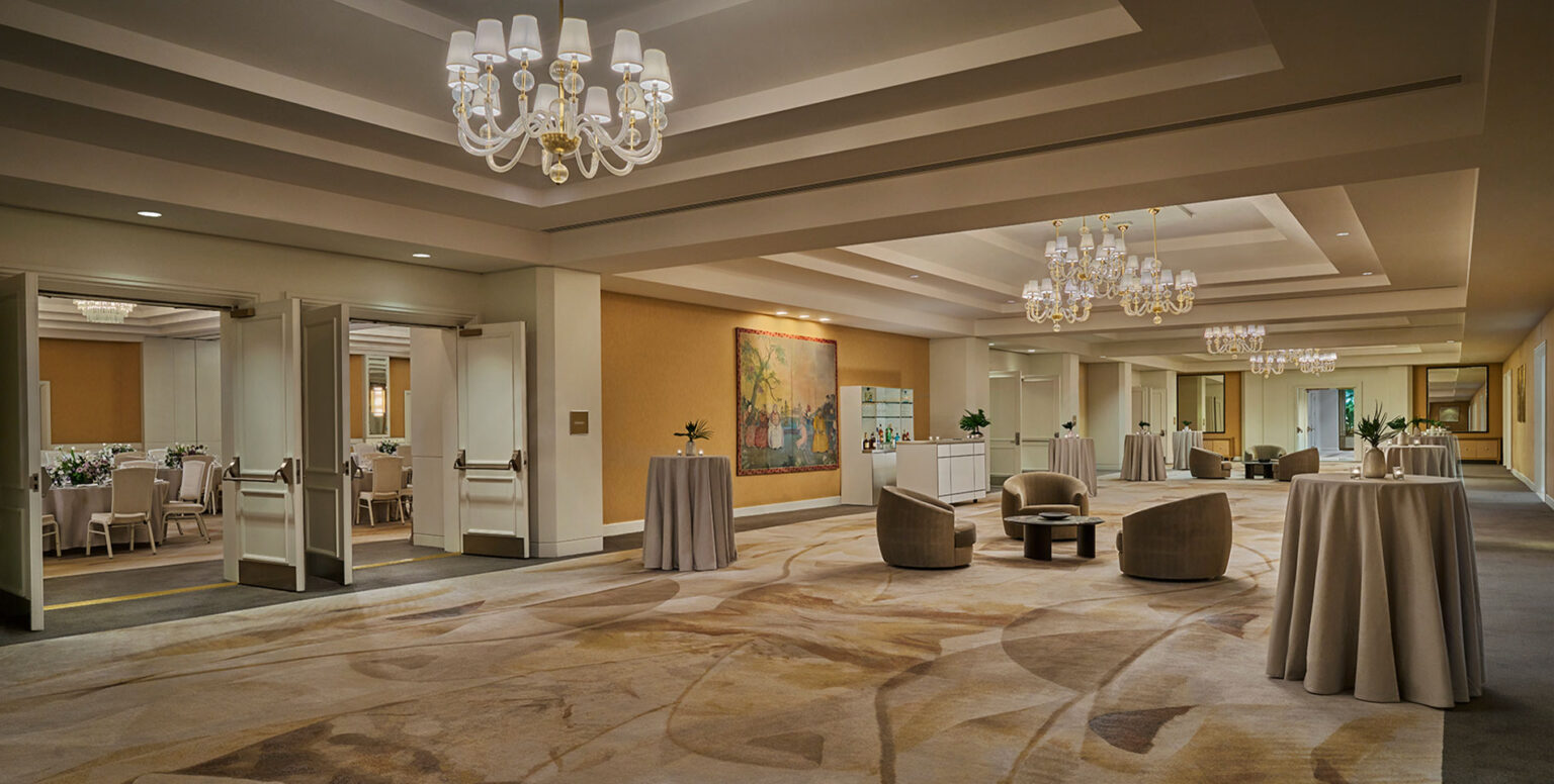 A pre-function room of a wedding reception at Pendry Newport Beach