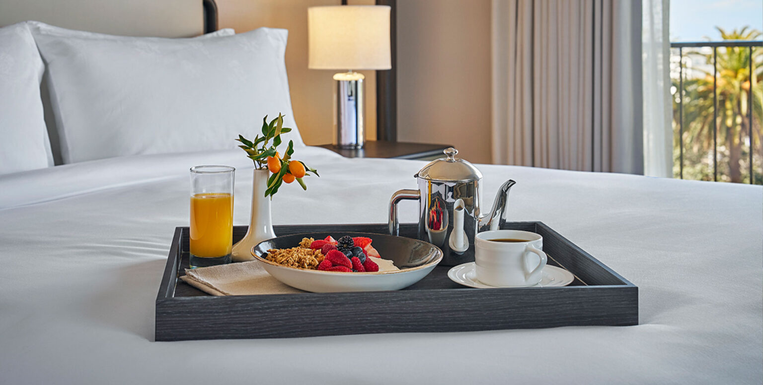 Room service breakfast in bed at Pendry Newport Beach