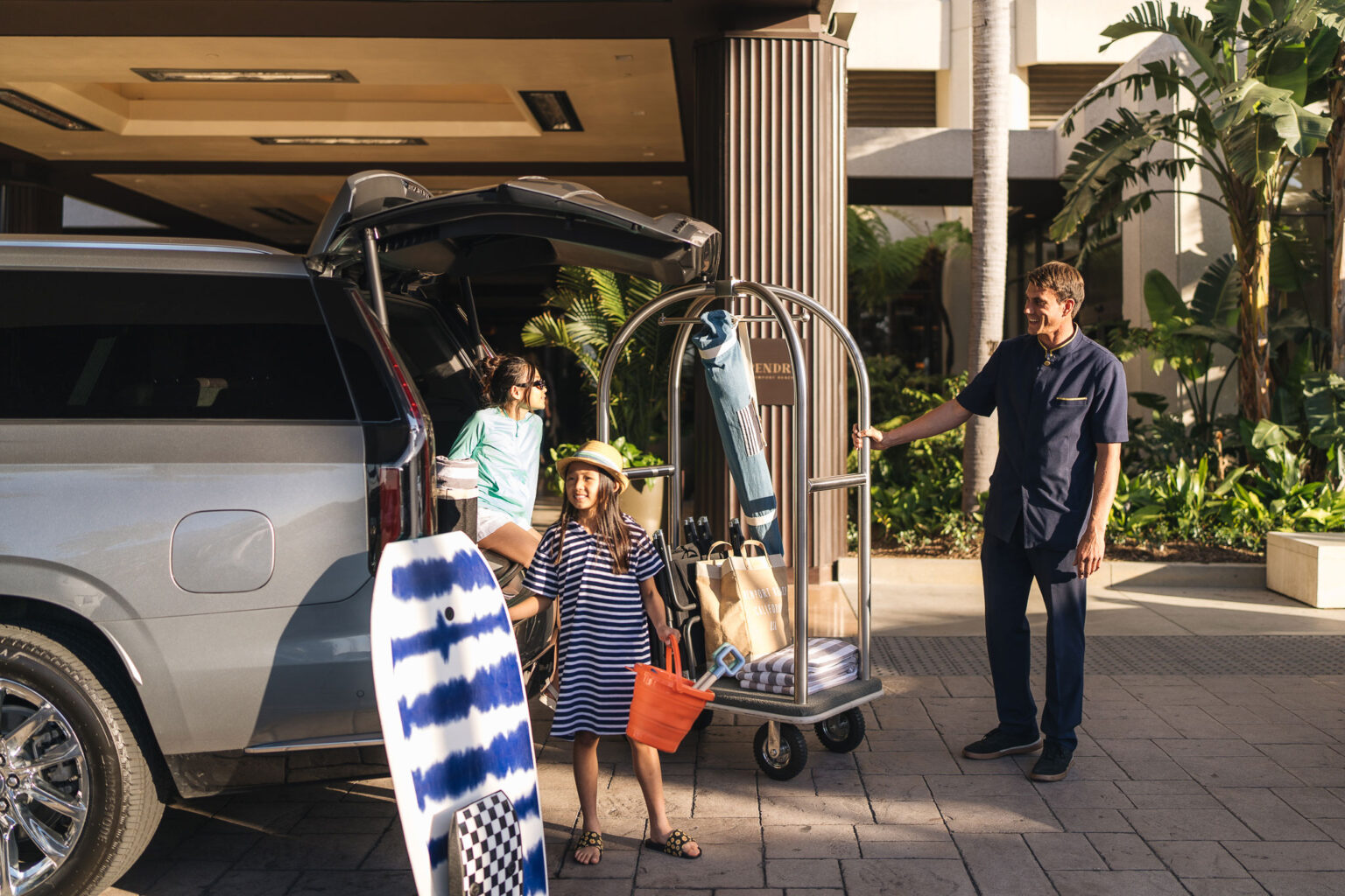 Family unloading the car at Pendry Newport Beach