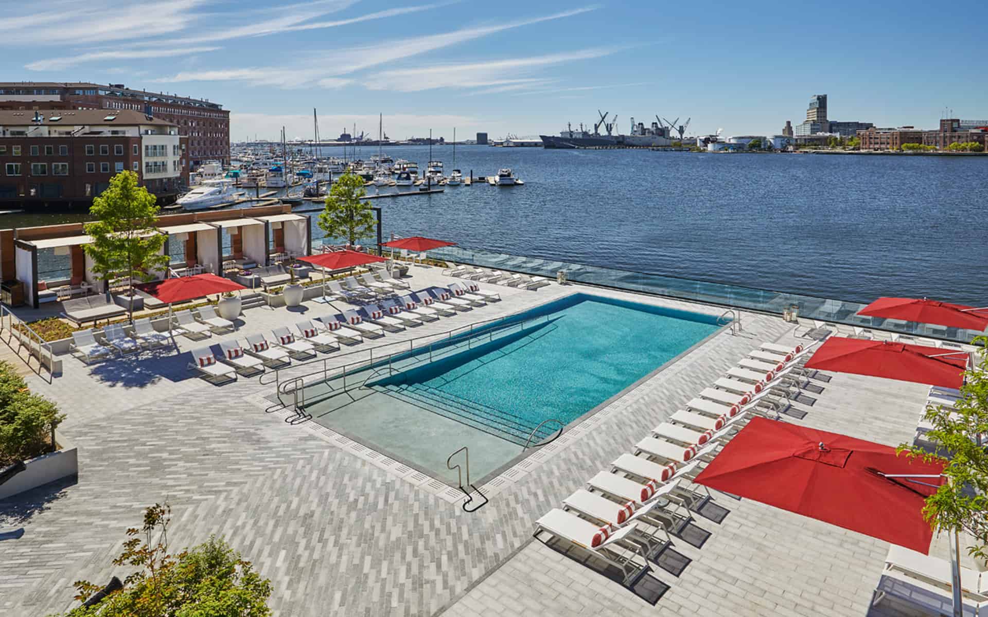 Aerial view of the pool and harbor during the day at Sagamore Pendry Baltimore