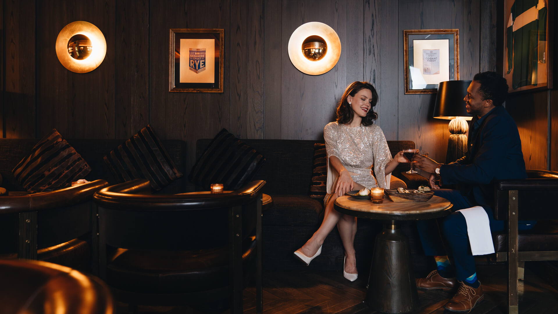 A couple enjoying a drink at Pendry Baltimore hotel.