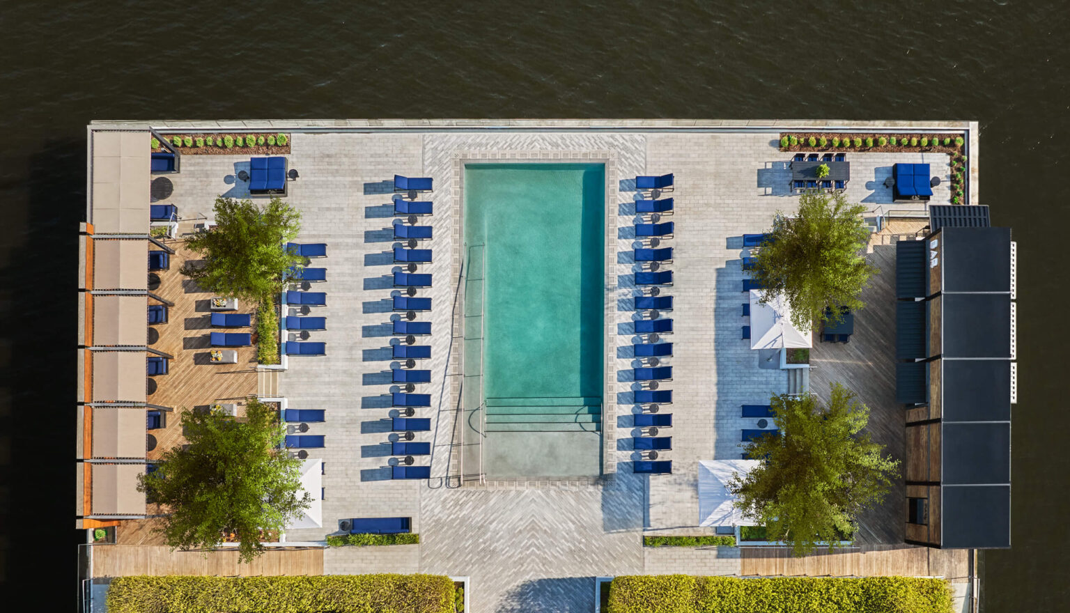 Aerial view of the pool and harbor during the day at Pendry Baltimore