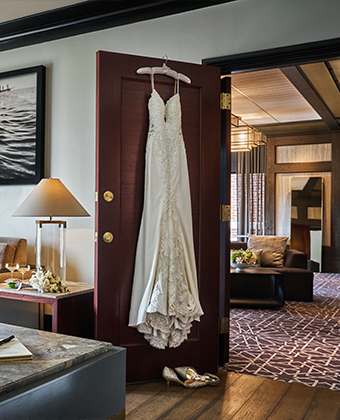 A wedding dress on a door