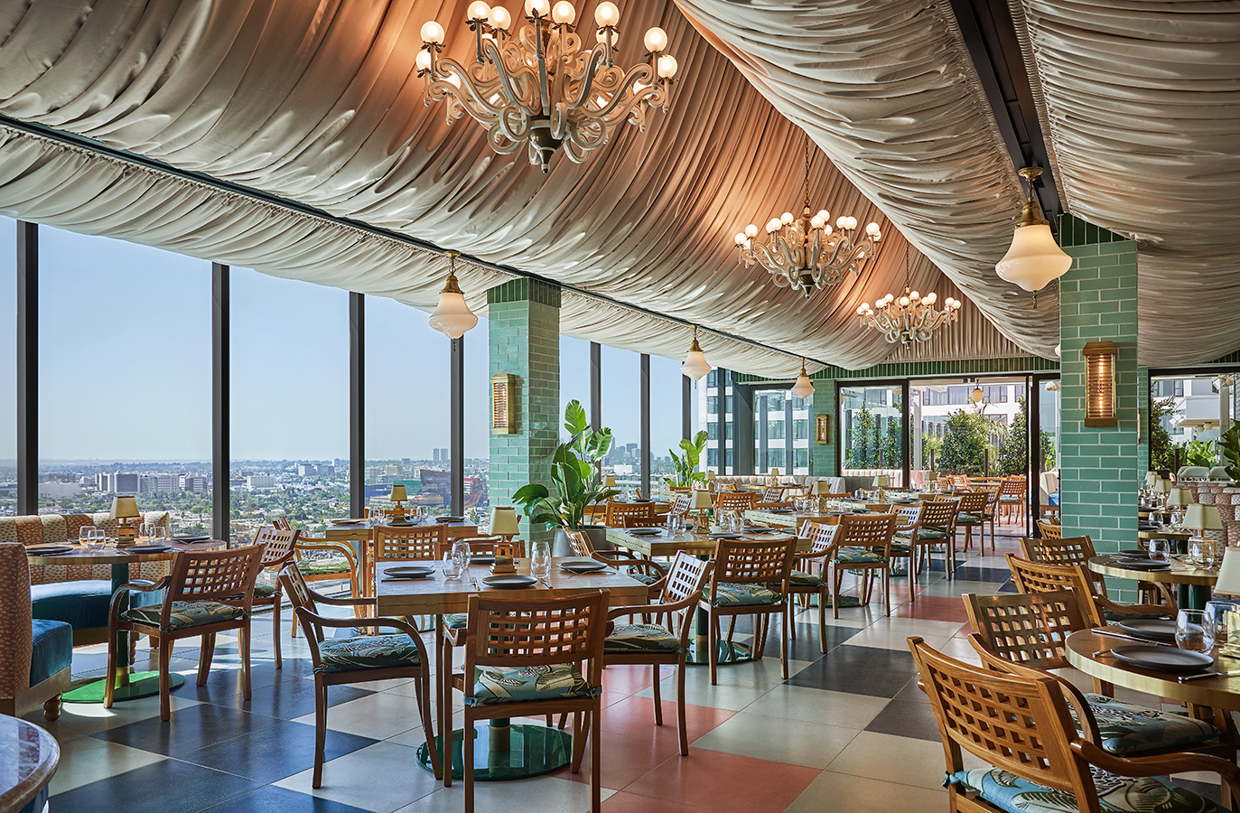 Merois restaurant interior with views of the city during day at luxury boutique hotel Pendry West Hollywood