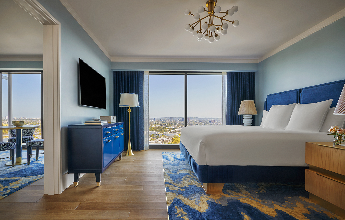 Deluxe Skyline Room bedroom with view of the city at Pendry West Hollywood a luxury hotel on sunset blvd