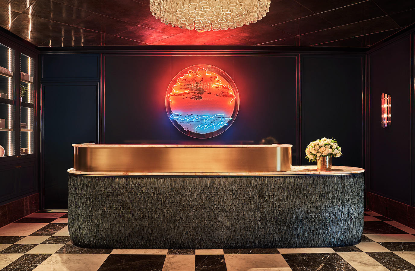 Lobby reservations desk with lighted sign at Pendry West Hollywood a luxury hotel on sunset blvd