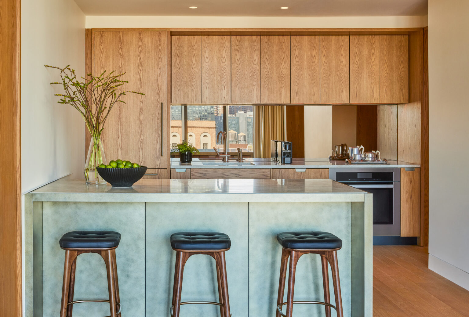 Kitchen counter with barstools at Pendry Manhattan West hotel