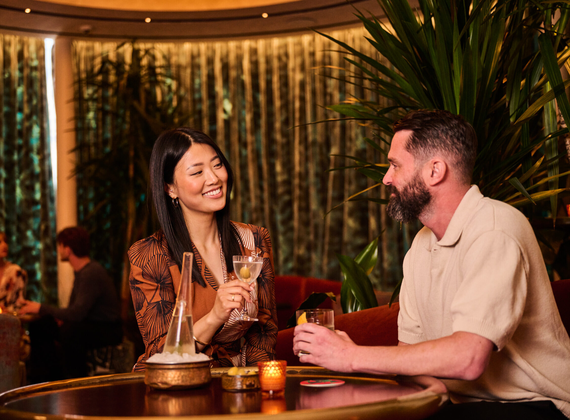 Couple enjoying cocktails in Chez Zou