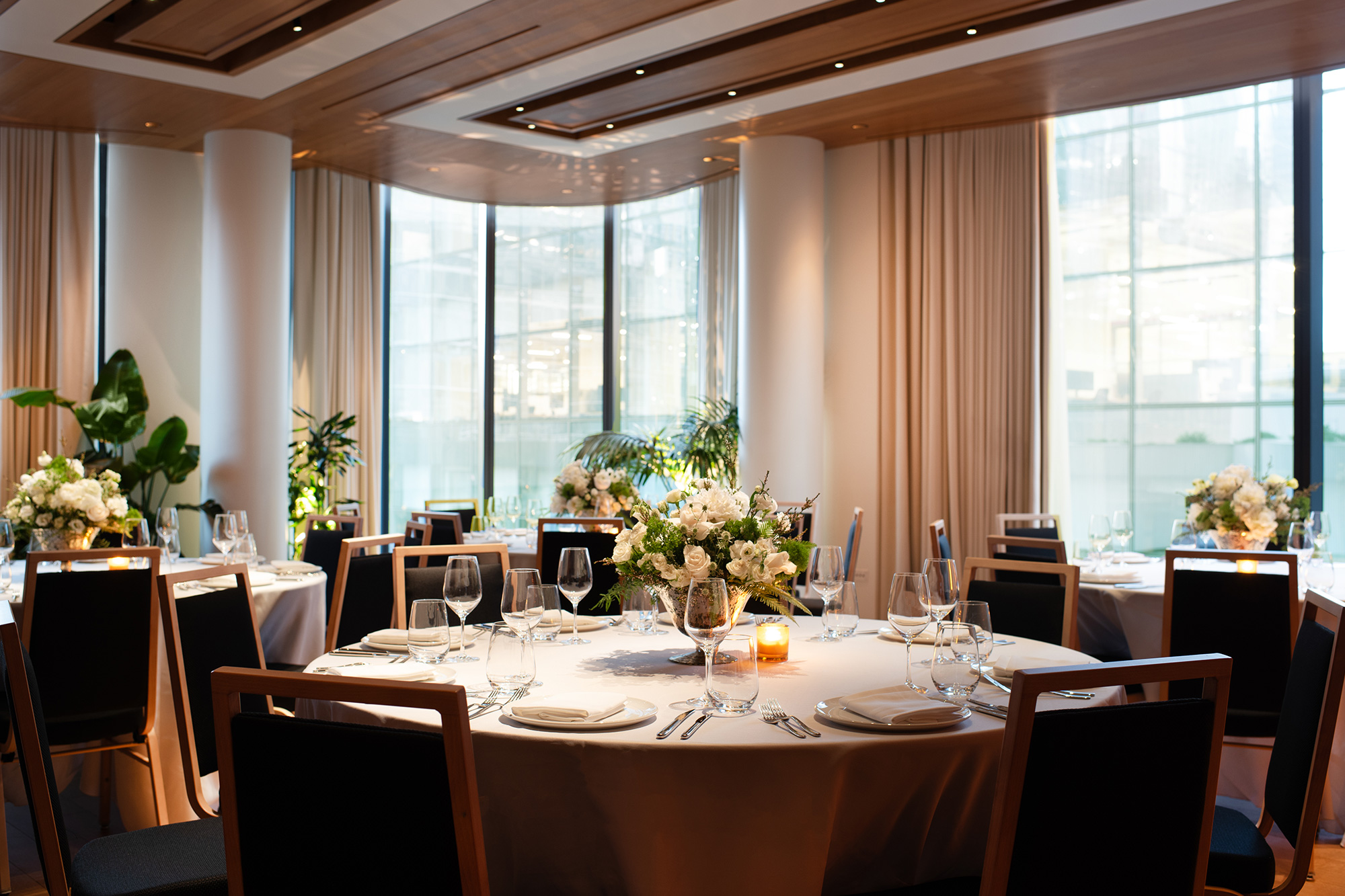 Gallery room at Pendry Manhattan West with tables set for an event.