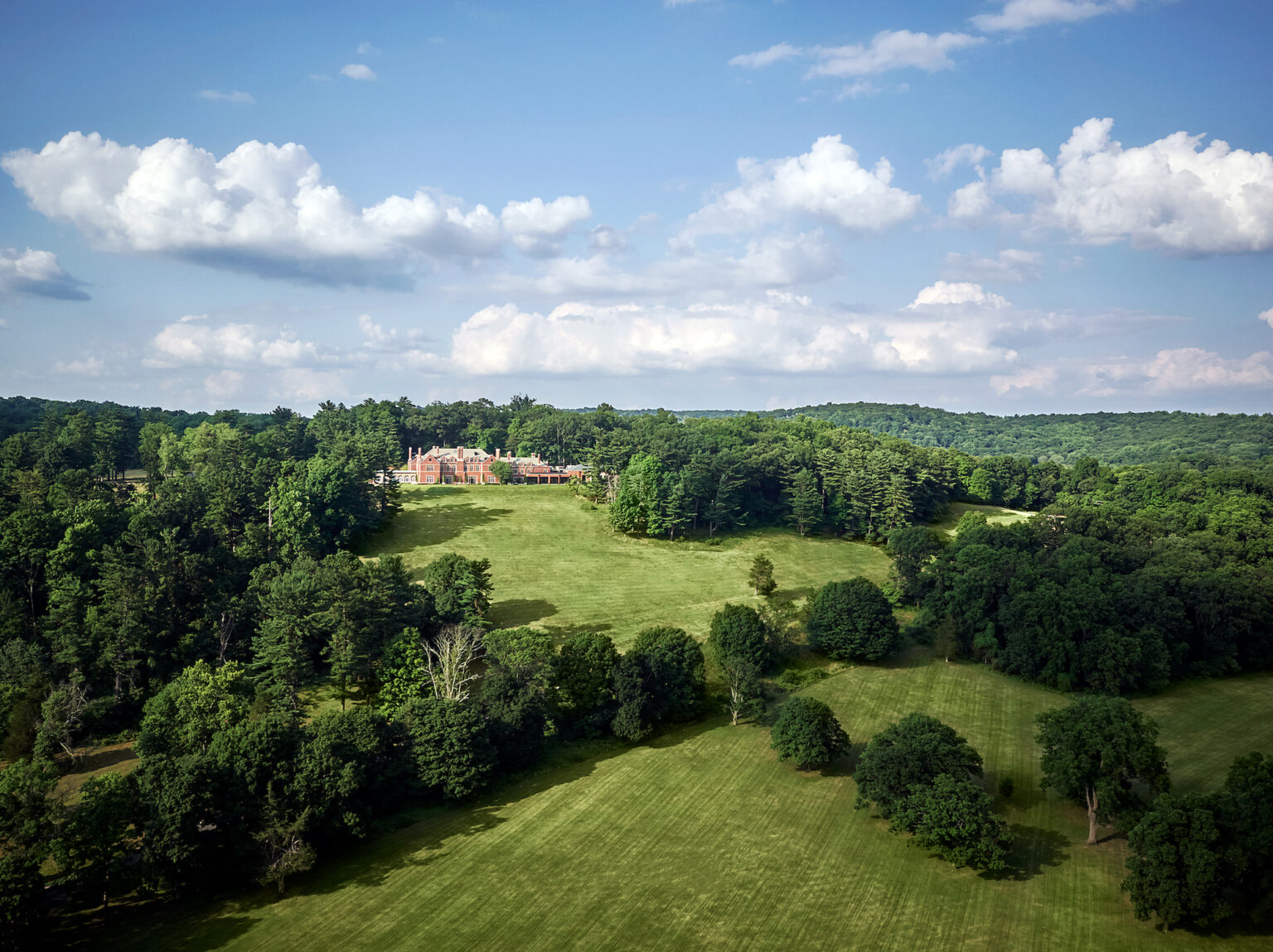 An overview of the Pendry Natirar mansion and rolling hills.