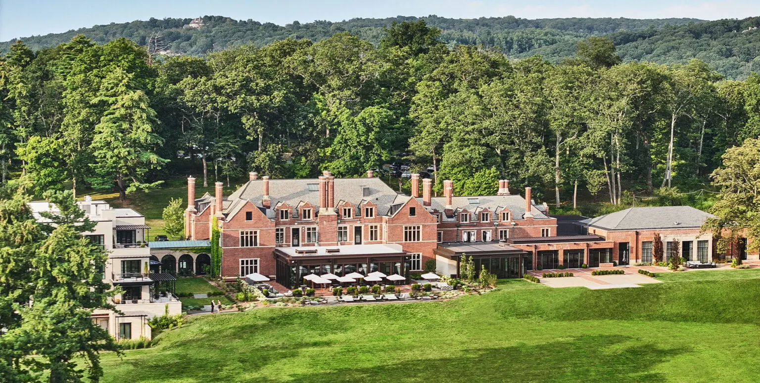 The exterior of Pendry Natirar with rolling Somerset hills behind it