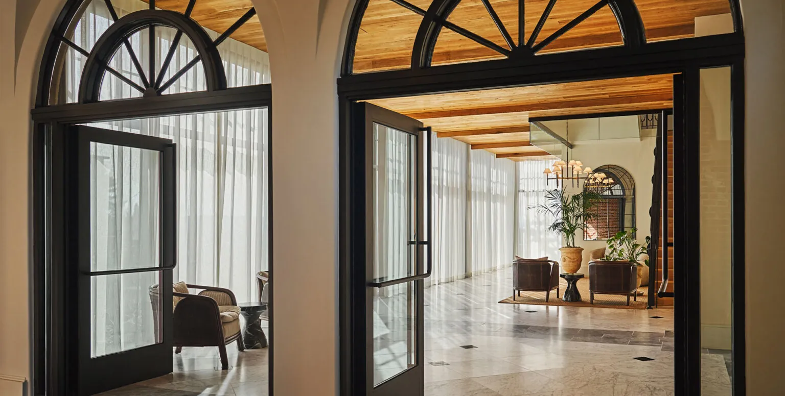 The lobby at Pendry Natirar with curved archways and marble floors