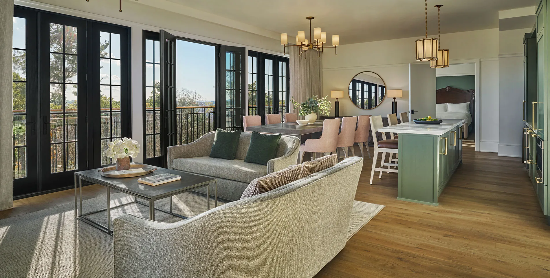 A living room, dining room and bar in a suite at Pendry Natirar resort