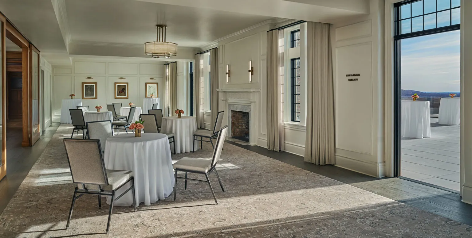 A meeting room with tables and chairs with an outside area at Pendry Natirar