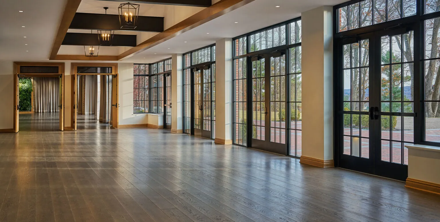 A pre-function room with floor to ceiling french doors at Pendry Natirar