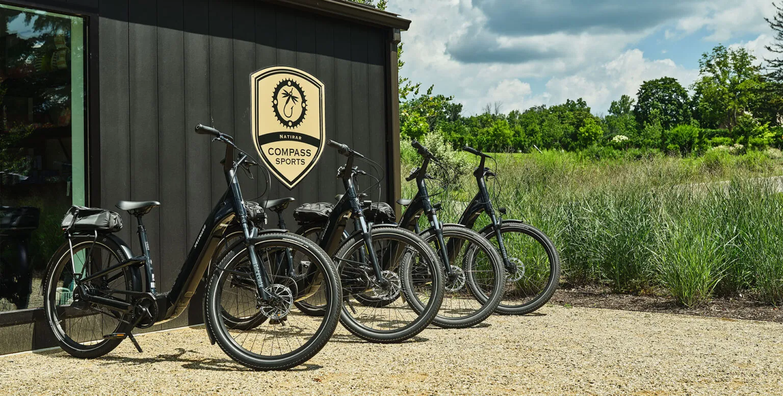 Four bikes outside of the Compass Sports facility at Pendry Natirar