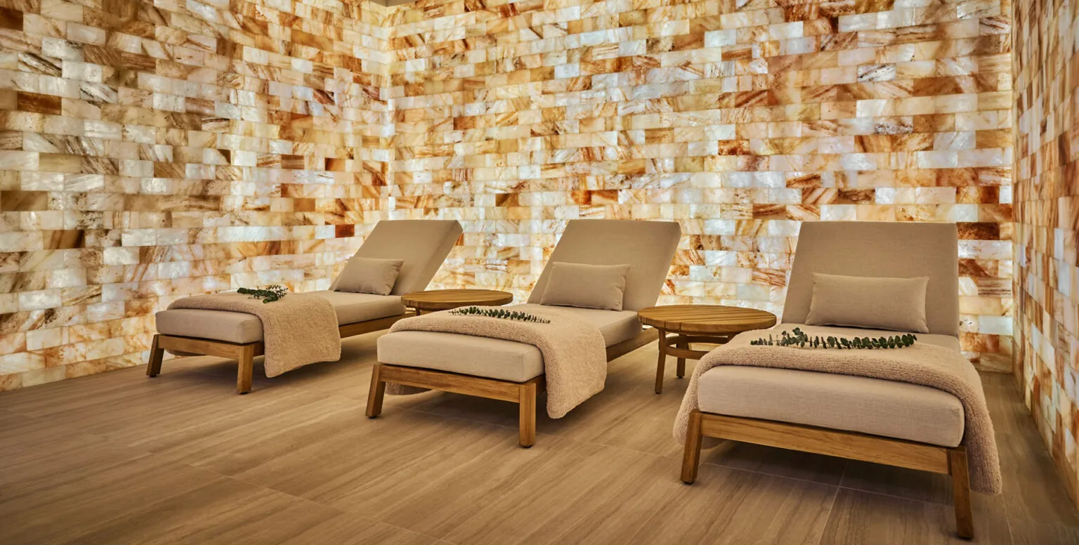 Three daybeds in a private spa room with marble walls at Pendry Natirar