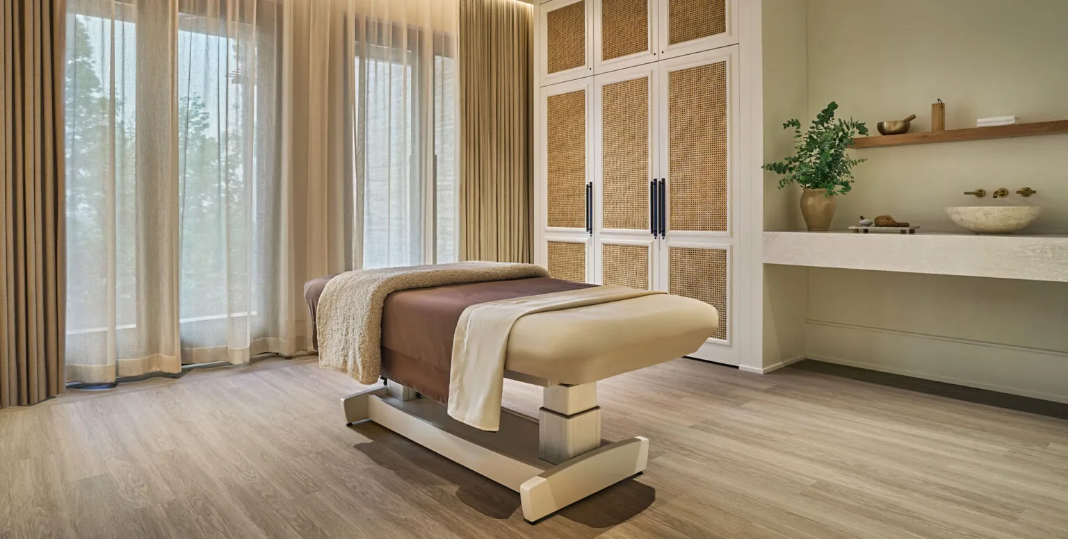 A massage table in a spa room at Pendry Natirar