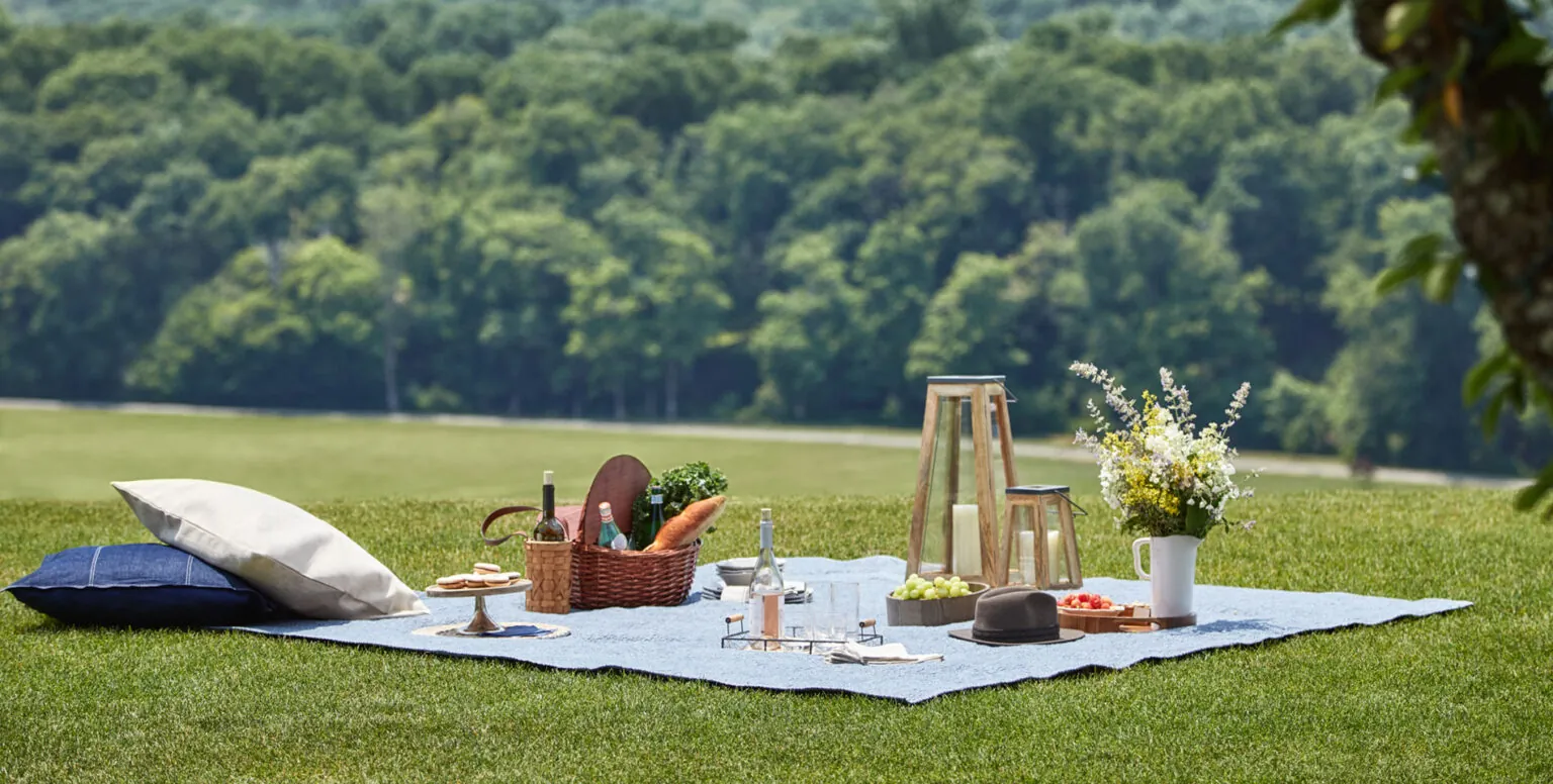 A picnic set up on the grounds of Pendry Natirar