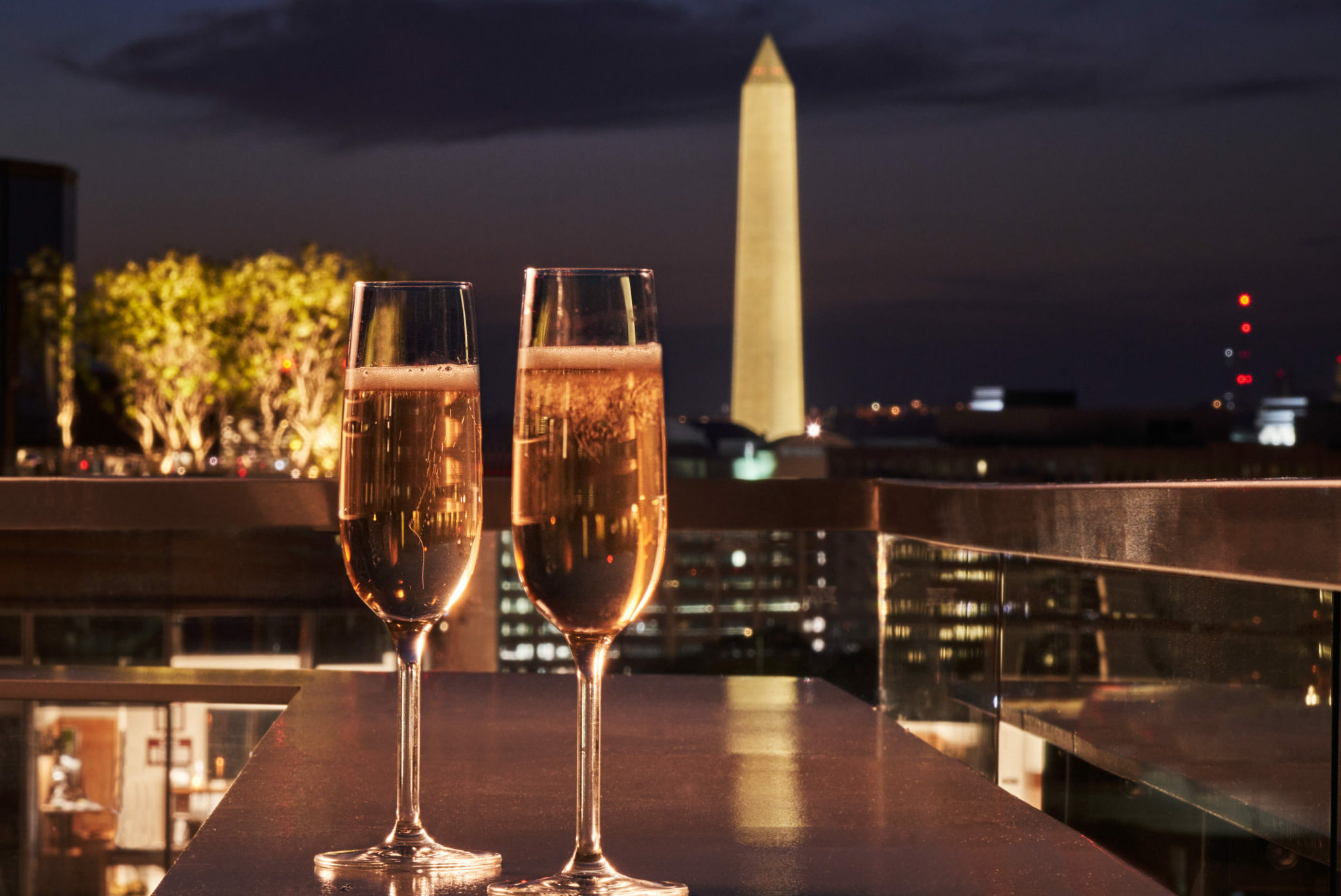 Two Glasses Of Champagne On Terrace At Night