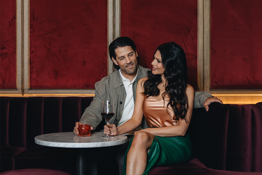 A couple enjoying cocktails at Pendry Washington DC.