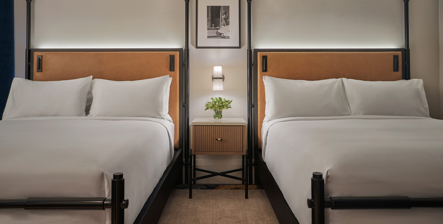 Two queen beds in a guestroom at Pendry Washington DC &ndash; The Wharf