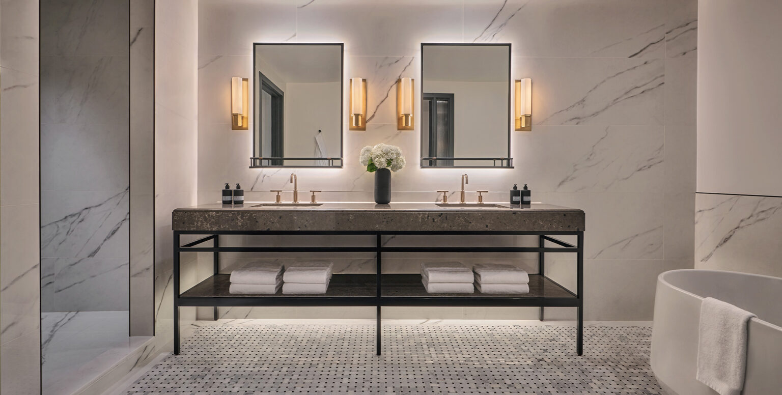 A double vanity in a white marble bathroom at Pendry Washington DC &ndash; The Wharf
