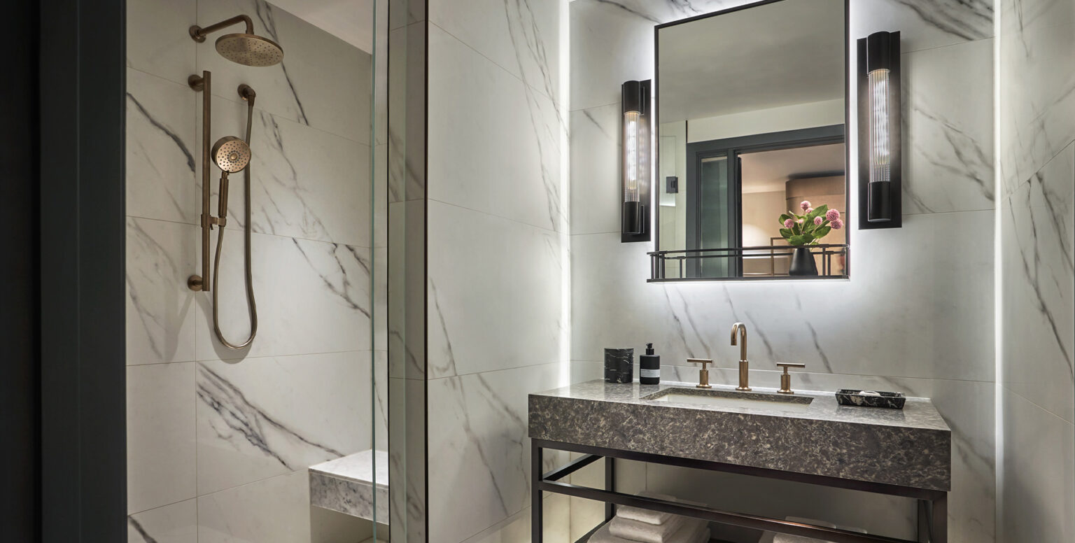 A white marble shower in a bathroom at Pendry Washington DC &ndash; The Wharf