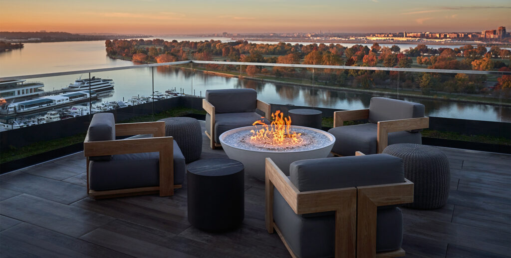 A DC rooftop patio overlooking the Washington Harbor at Pendry Washington DC – The Wharf