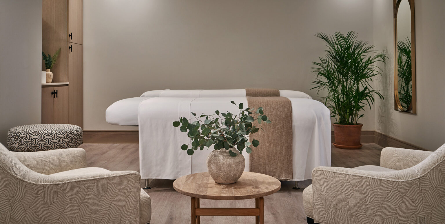 Two massage tables with chairs beside them at Spa Pendry Washington DC