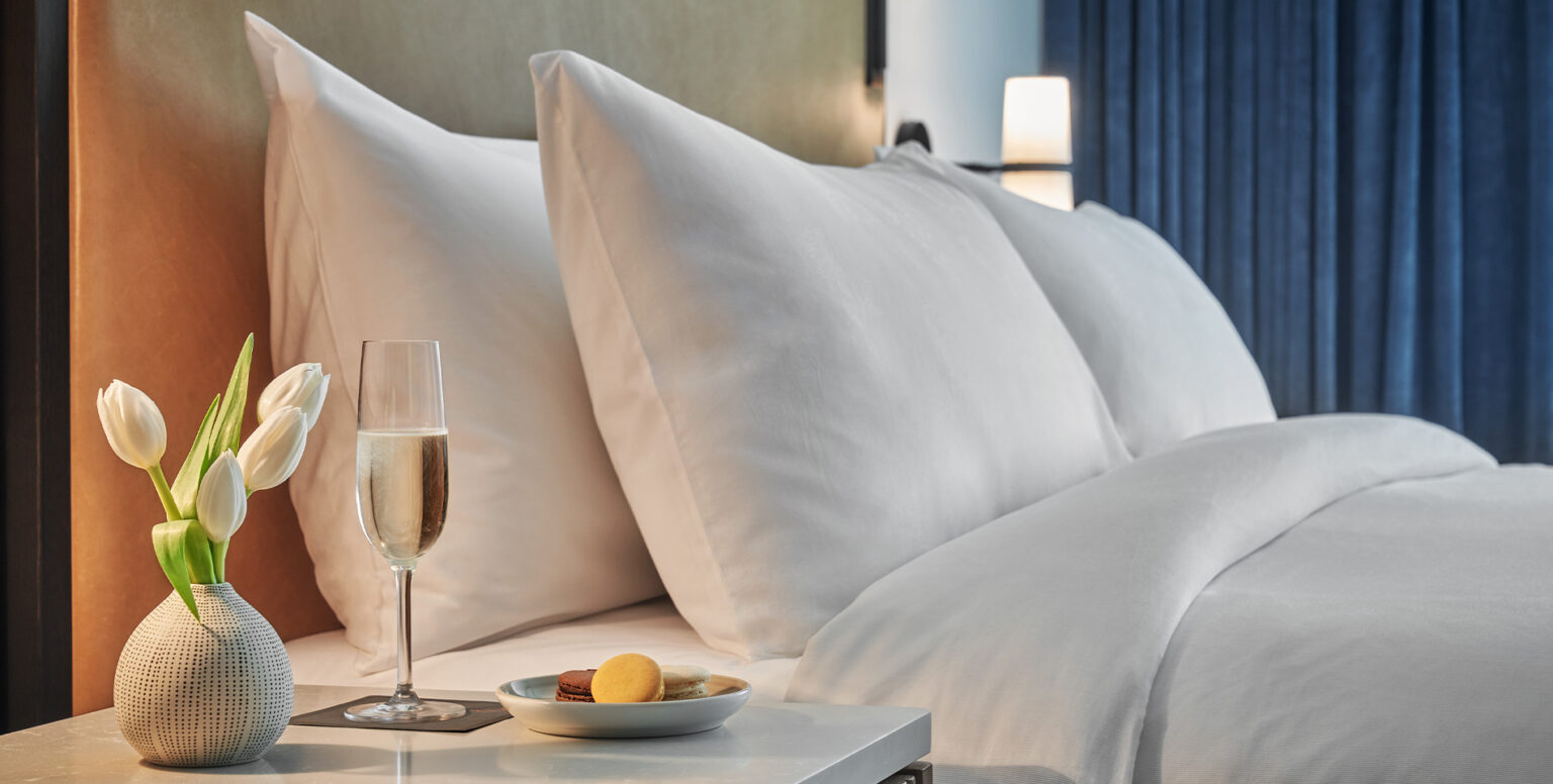 A glass of champagne on a nightstand at Pendry Washington DC &ndash; The Wharf