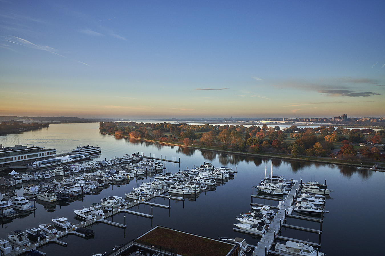 The wharf outside of Pendry Washington DC with boats parked at the dock